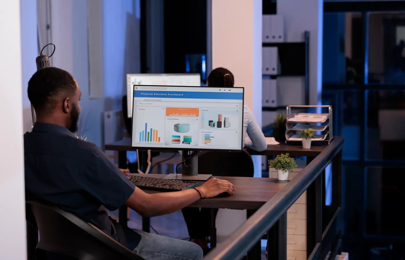 A professional reviewing business information on a computer